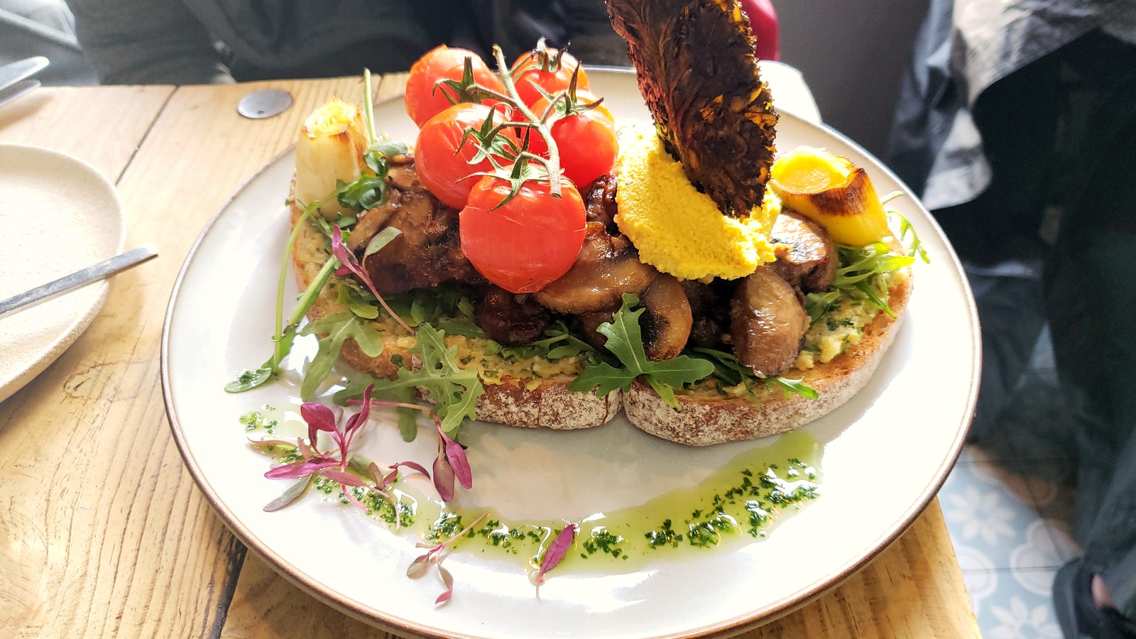 Garlic mushrooms on sourdough with roasted tomatoes — the kitchen reward after a home harvest